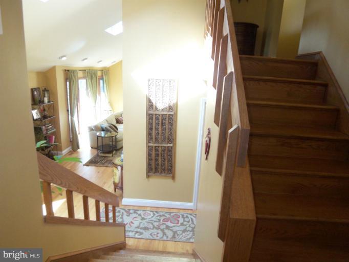 1226 Blue Mt Road Monkton, MD 21111 - Photo 4 of 30 a view of staircase with wooden floor and chair