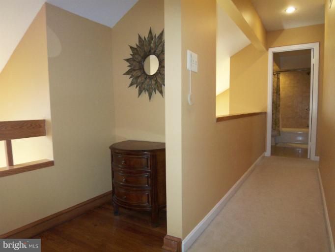 1226 Blue Mt Road Monkton, MD 21111 - Photo 6 of 30 a view of a hallway to rooms and wooden floor