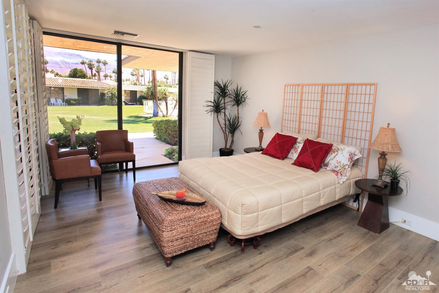 16 Reed Court Rancho Mirage, CA 92270 - Photo 5 of 38 a bedroom with a bed and large window