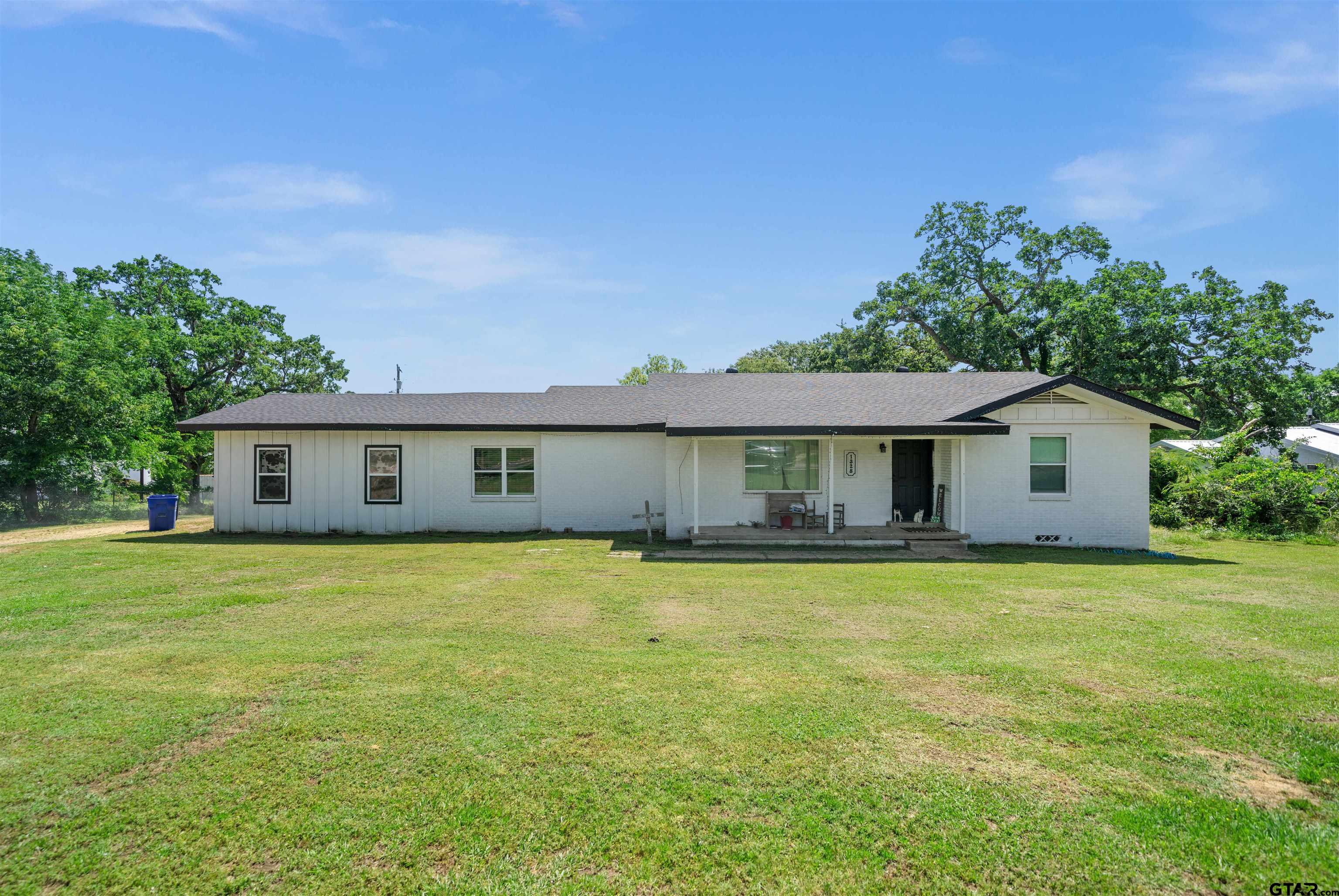 a view of a house with a big yard