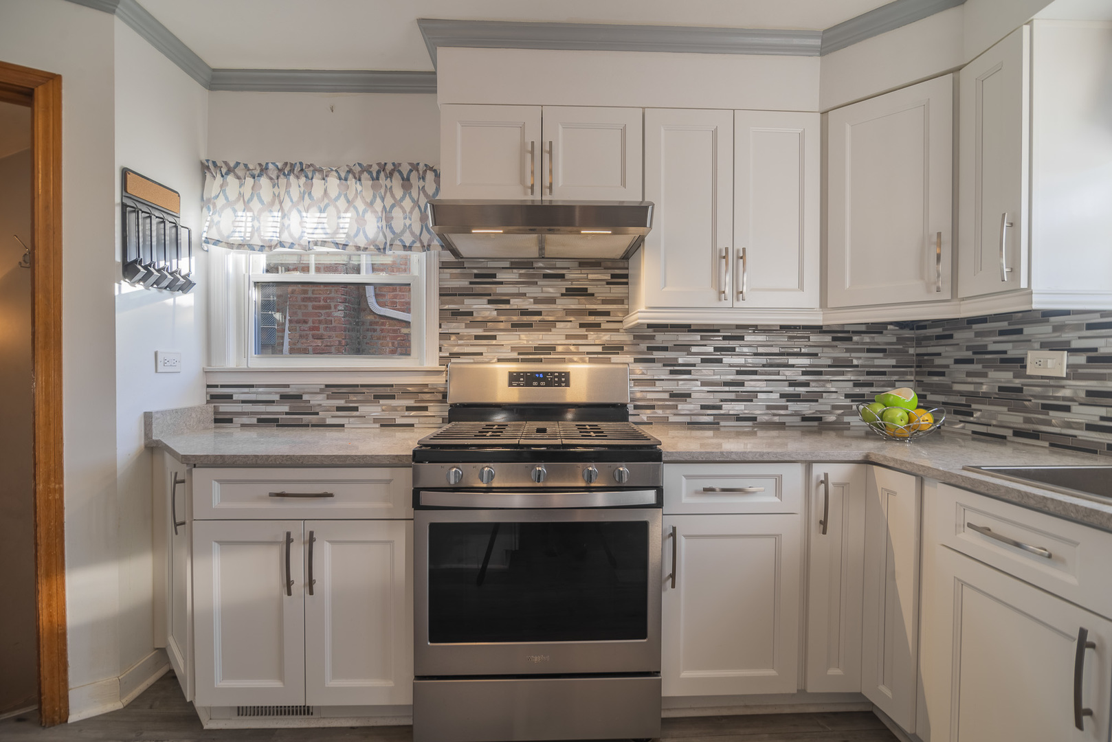 5250 South Nagle Avenue Chicago, IL 60638 - Photo 3 of 21 a kitchen with white cabinets and appliances