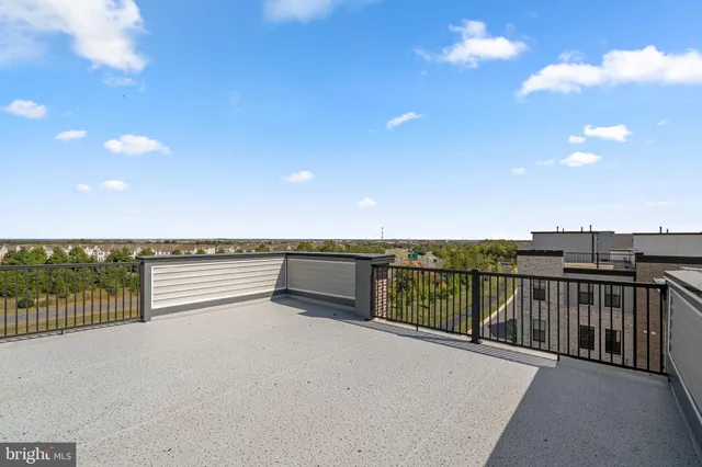 a view of a kitchen with stainless steel appliances