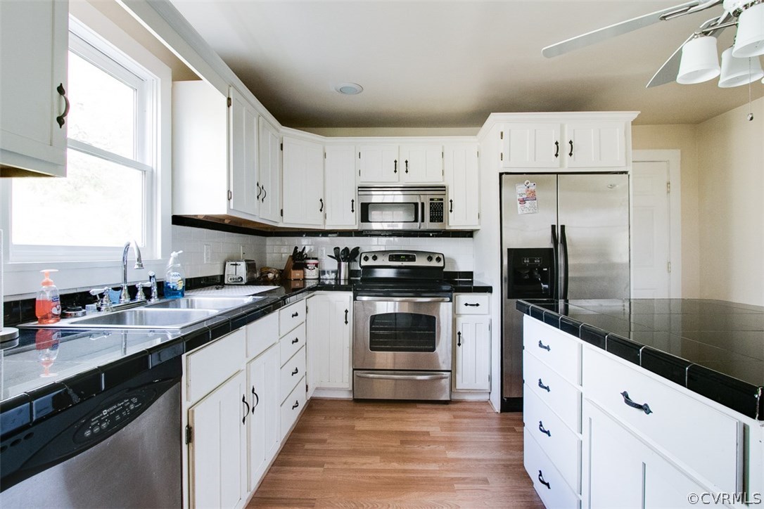 11501 Winterpock Road Chesterfield, VA 23838 - Photo 13 of 30 a kitchen with granite countertop white cabinets and white appliances