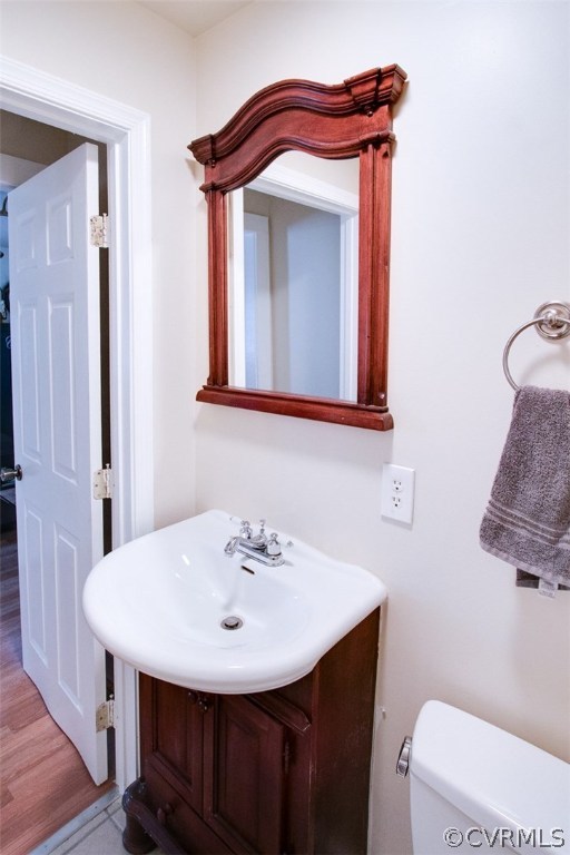 11501 Winterpock Road Chesterfield, VA 23838 - Photo 15 of 30 a bathroom with a sink a toilet and mirror