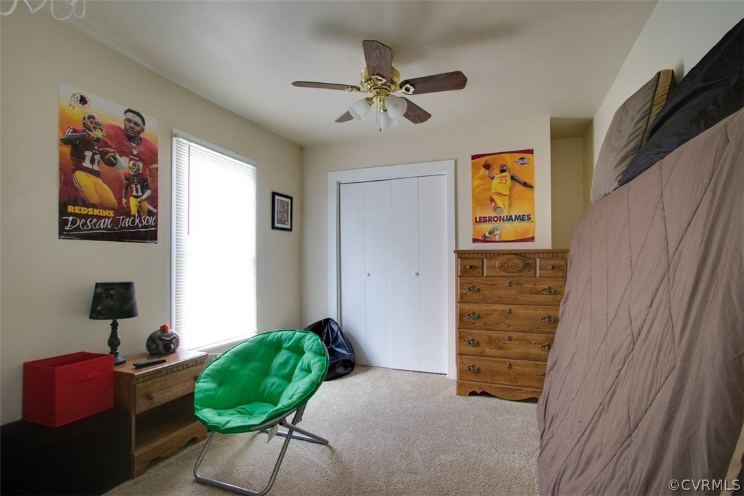 11501 Winterpock Road Chesterfield, VA 23838 - Photo 22 of 30 a bedroom with a bed and a chandelier