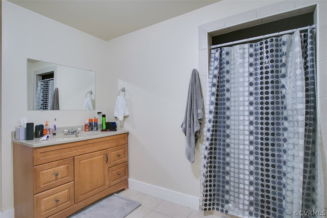 11501 Winterpock Road Chesterfield, VA 23838 - Photo 26 of 30 a bathroom with a shower curtain and a sink
