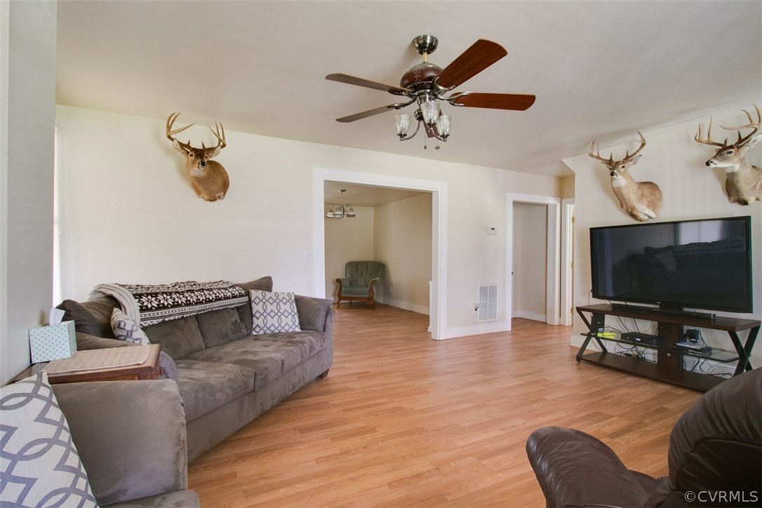 11501 Winterpock Road Chesterfield, VA 23838 - Photo 5 of 30 a living room with furniture and a flat screen tv