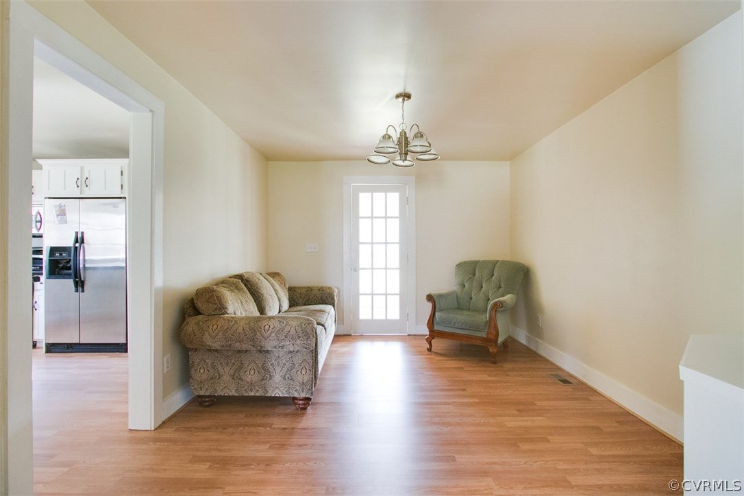 11501 Winterpock Road Chesterfield, VA 23838 - Photo 10 of 30 a living room with furniture and a chandelier