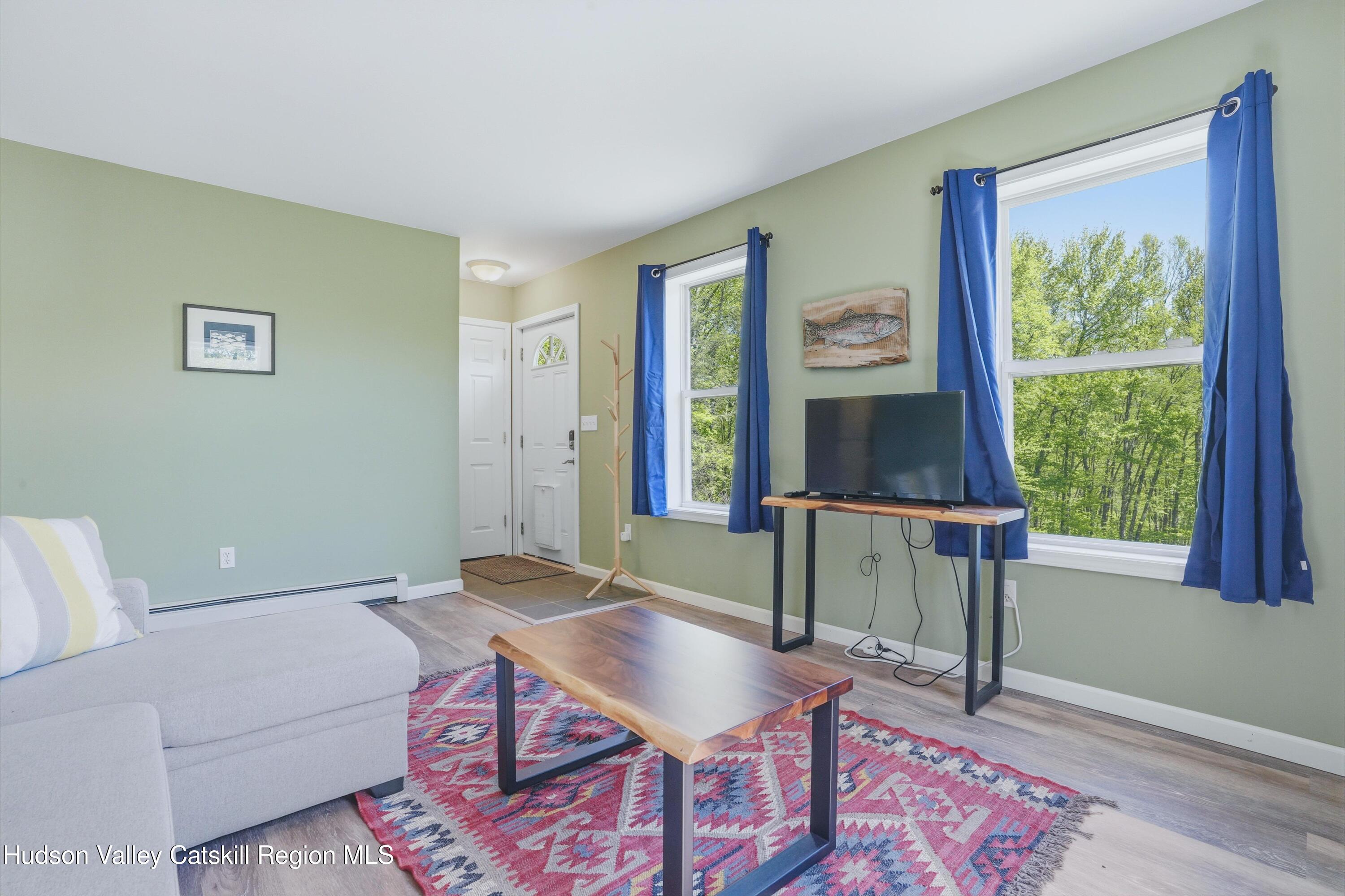 5217 State Rte 55 Grahamsville, NY 12740 - Photo 9 of 20 a living room with furniture and a window
