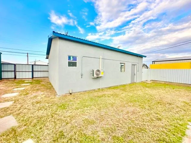 a view of a swimming pool with outdoor seating
