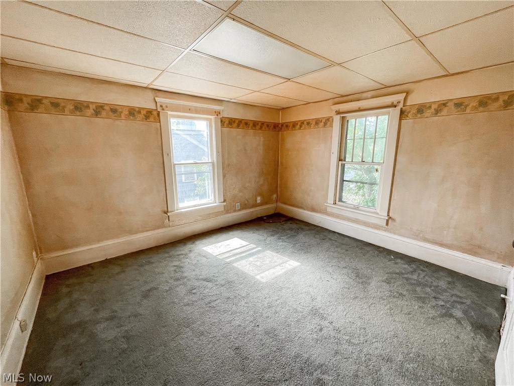 2811 9th Street Northwest Canton, OH 44708 - Photo 12 of 20 Carpeted empty room featuring a drop ceiling