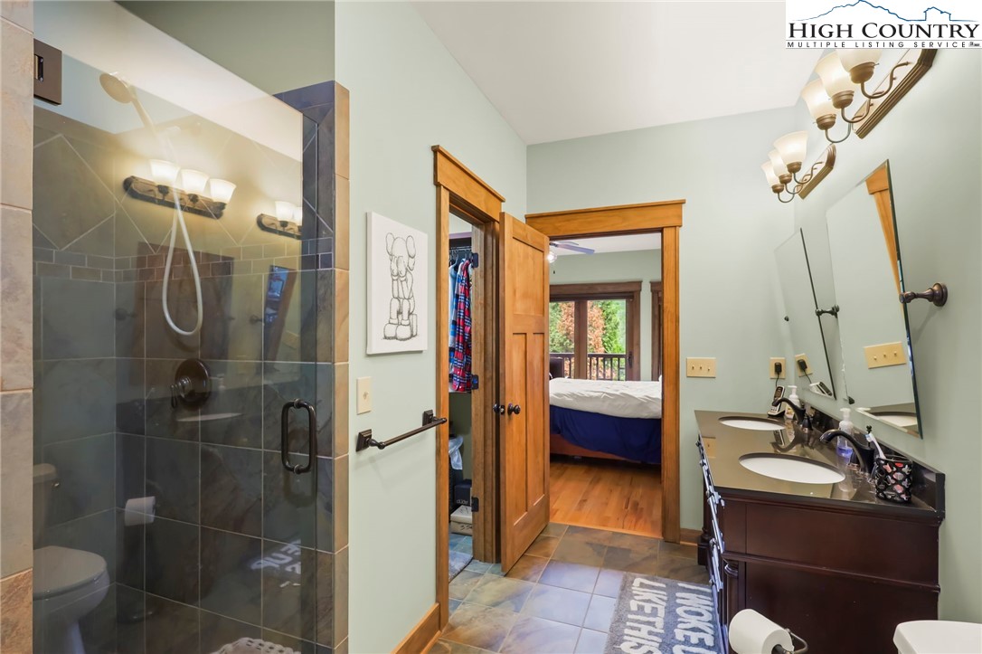 138 South Camp Road, Unit 103 Boone, NC 28607 - Photo 25 of 50 a bathroom with a sink a toilet and shower
