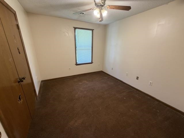 9450 Holly Grove Road Brighton, TN 38011 - Photo 7 of 10 Room featuring brown carpet flooring, light-colored walls, and a window with blinds