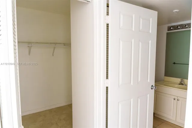 a view of a bathroom with a shower curtain