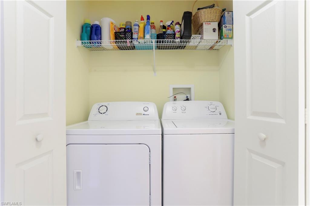 337 Robin Hood Circle, Unit 204 Naples, FL 34104 - Photo 12 of 23 a utility room with dryer and washer