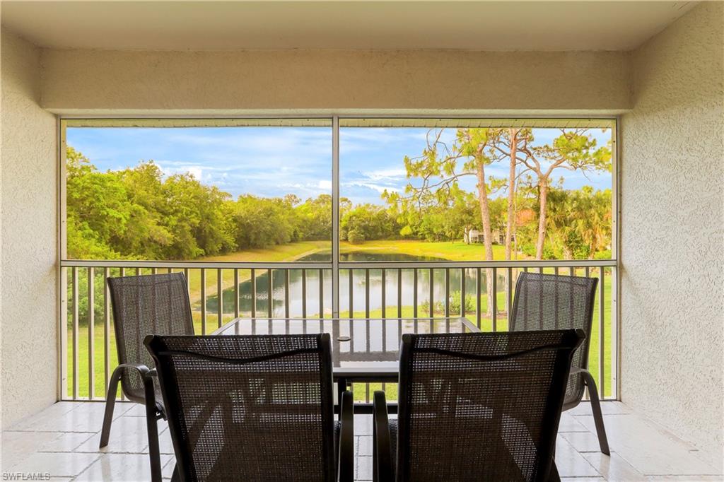 337 Robin Hood Circle, Unit 204 Naples, FL 34104 - Photo 16 of 23 a view of a balcony with chairs