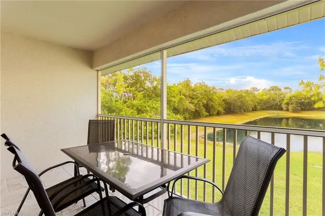 a view of a house with a yard and garage