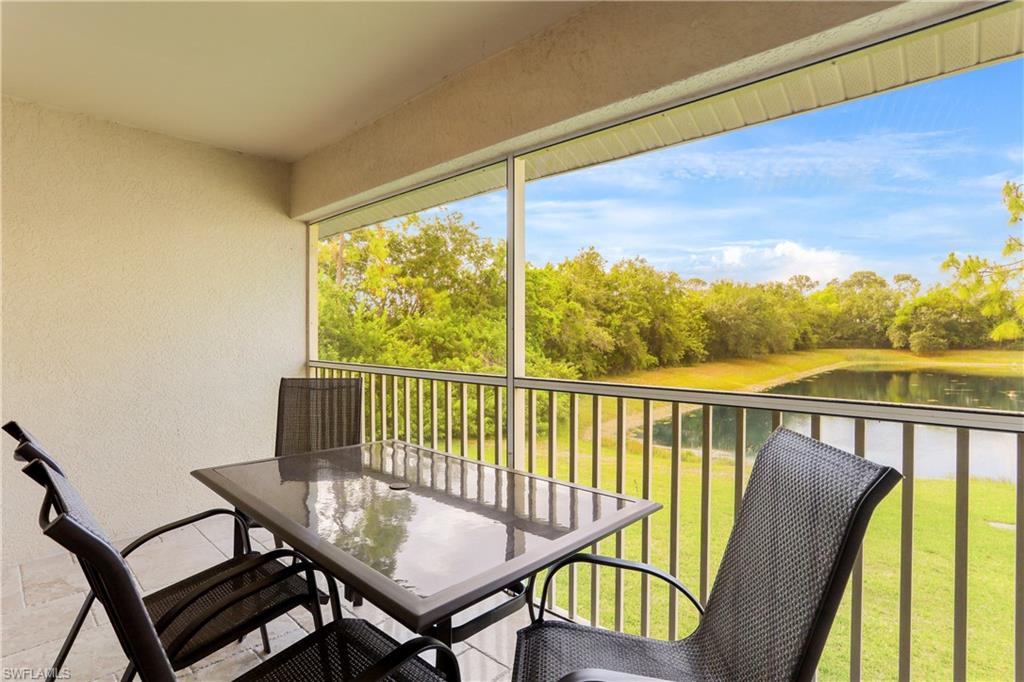 337 Robin Hood Circle, Unit 204 Naples, FL 34104 - Photo 17 of 23 a view of a city from a balcony