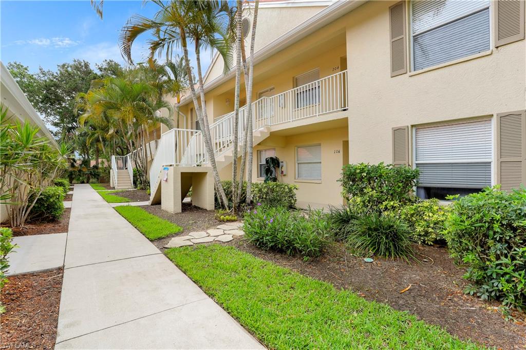 337 Robin Hood Circle, Unit 204 Naples, FL 34104 - Photo 19 of 23 a view of a back yard of the house