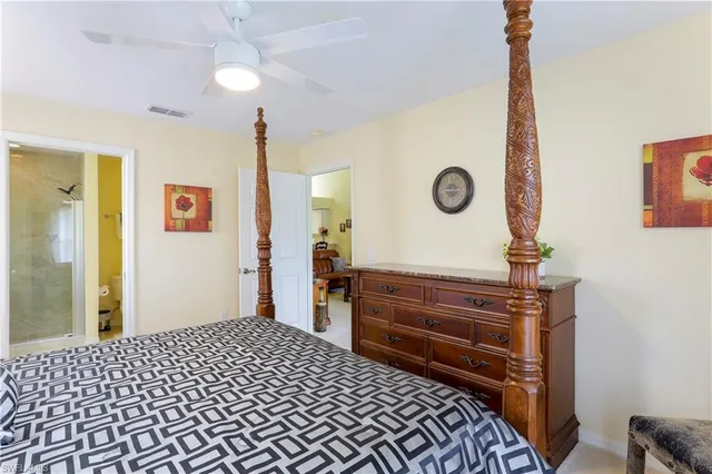 a bedroom with a bed and a dresser