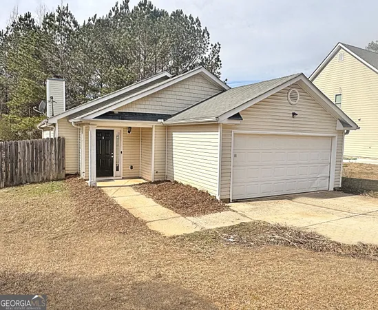 a view of garage and yard