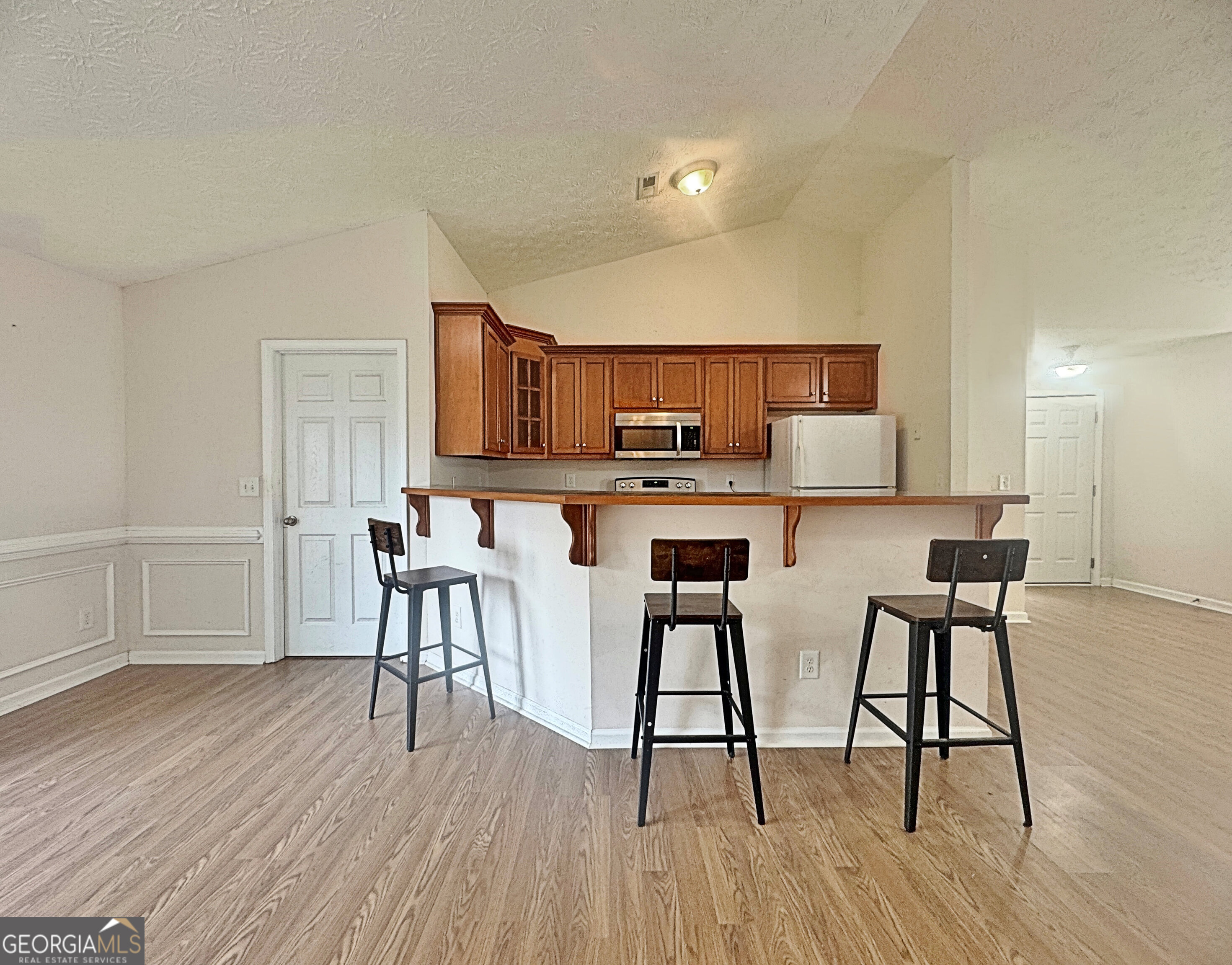 203 Jerry Road Hogansville, GA 30230 - Photo 14 of 49 a view of kitchen with cabinets and wooden floor