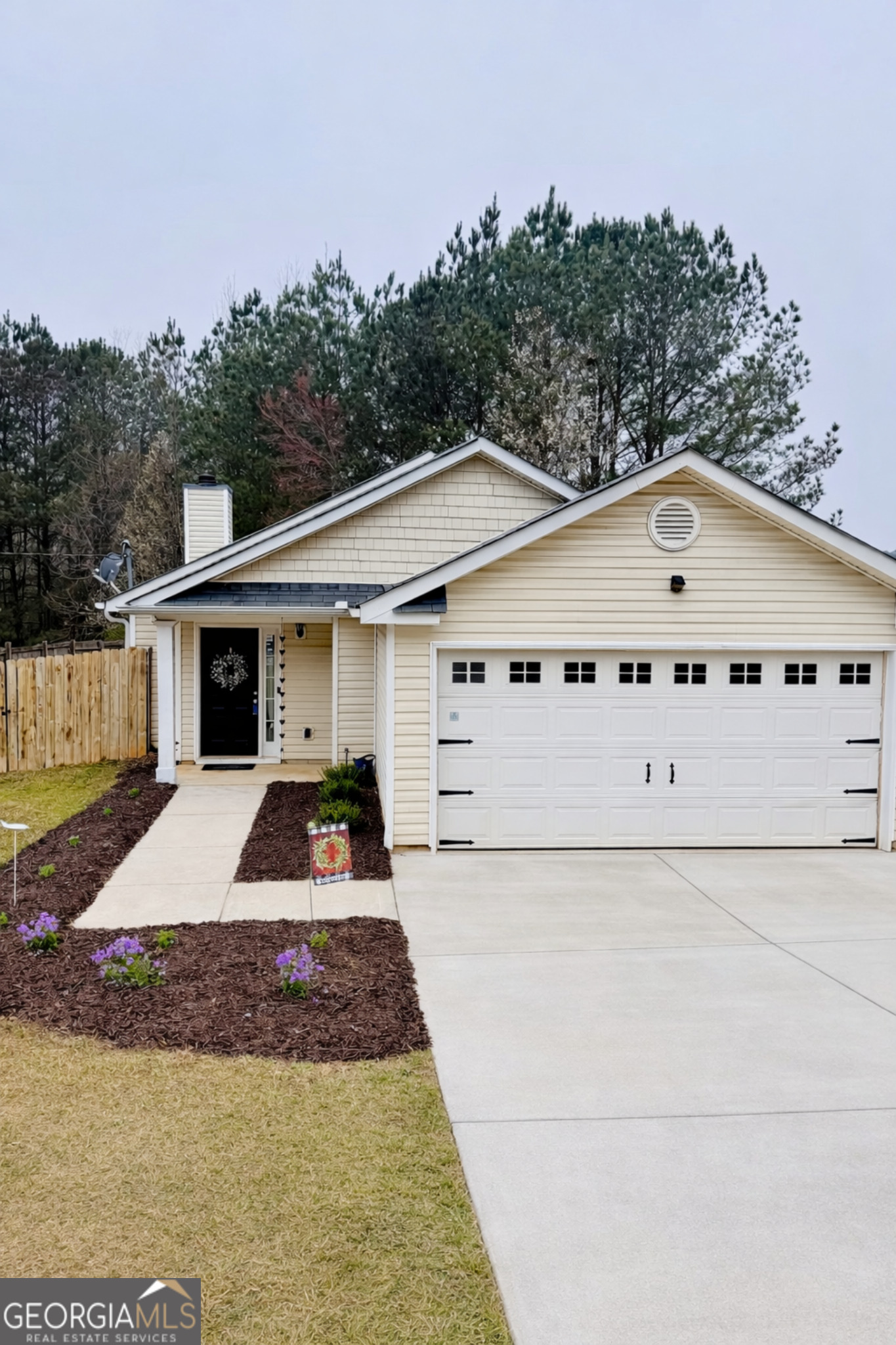 203 Jerry Road Hogansville, GA 30230 - Photo 2 of 51 a front view of a house with a yard and garage