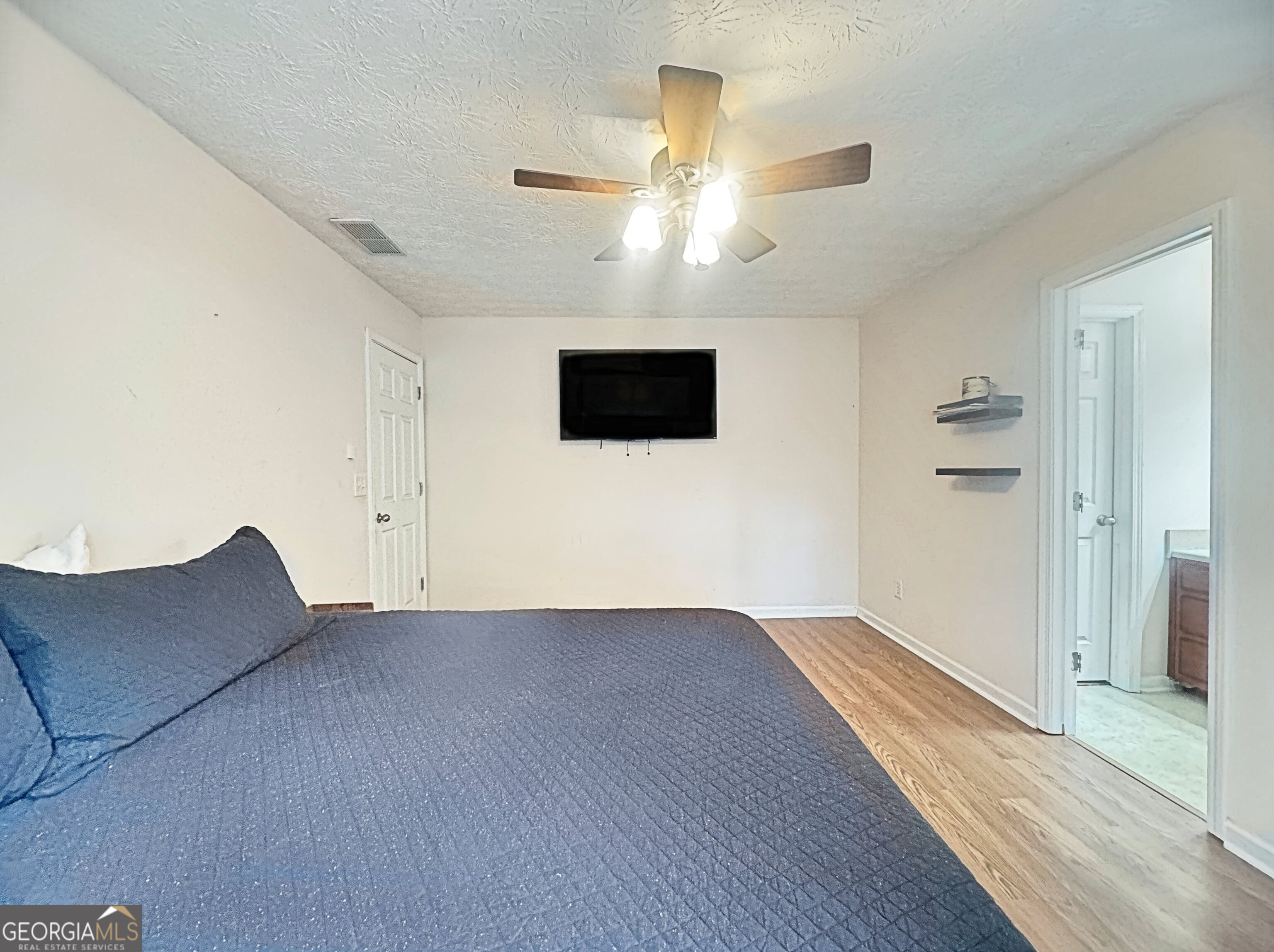 203 Jerry Road Hogansville, GA 30230 - Photo 32 of 51 an empty room with wooden floor and windows