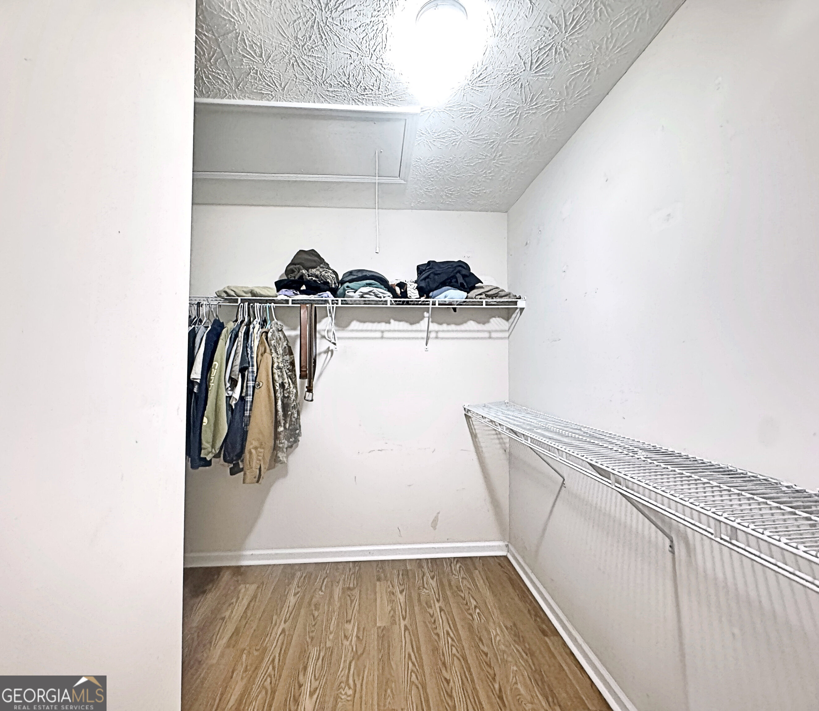 203 Jerry Road Hogansville, GA 30230 - Photo 32 of 49 a view of walk in closet with clothes and shoes