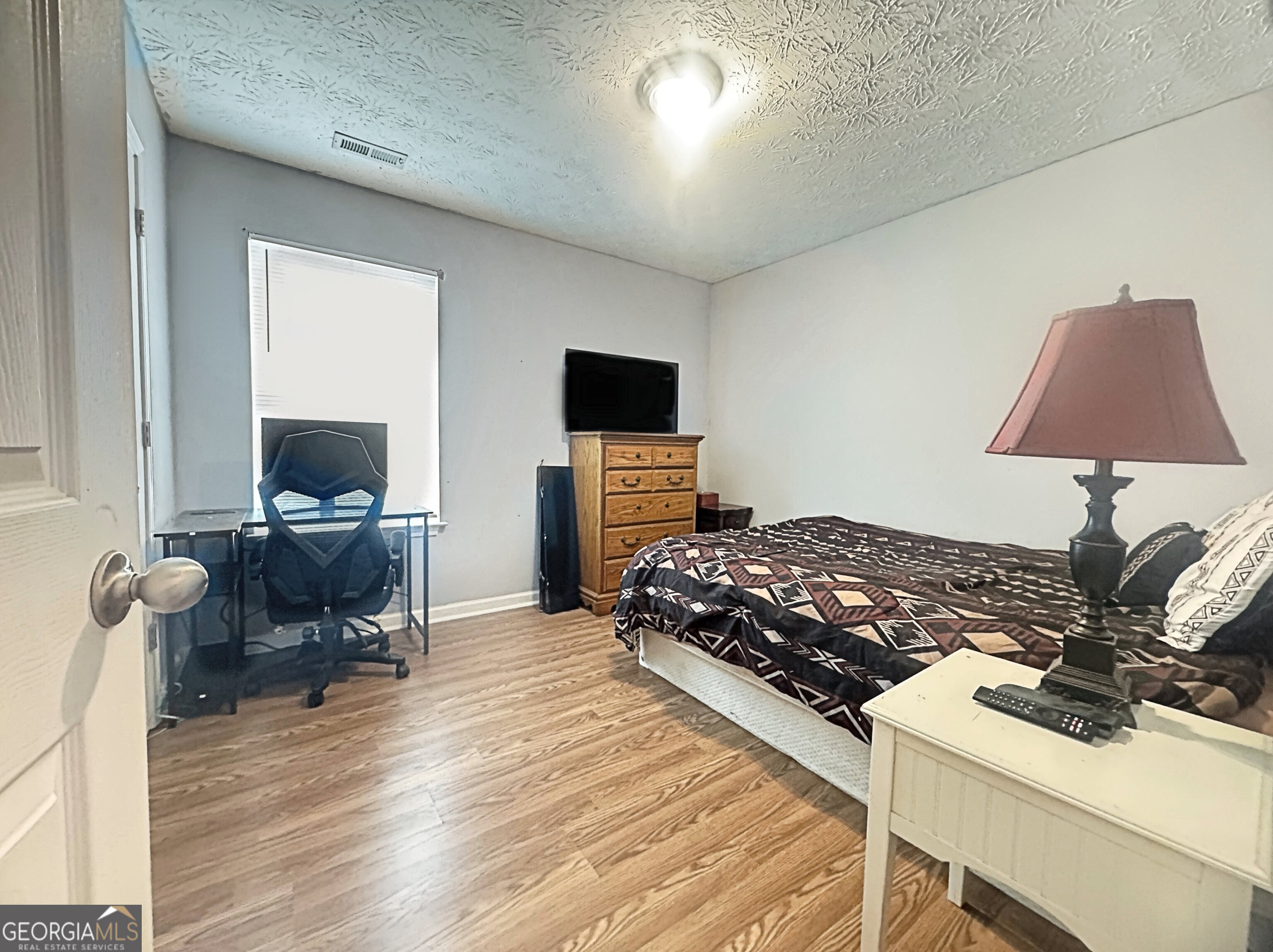 203 Jerry Road Hogansville, GA 30230 - Photo 34 of 49 a bedroom with a bed and a flat screen tv