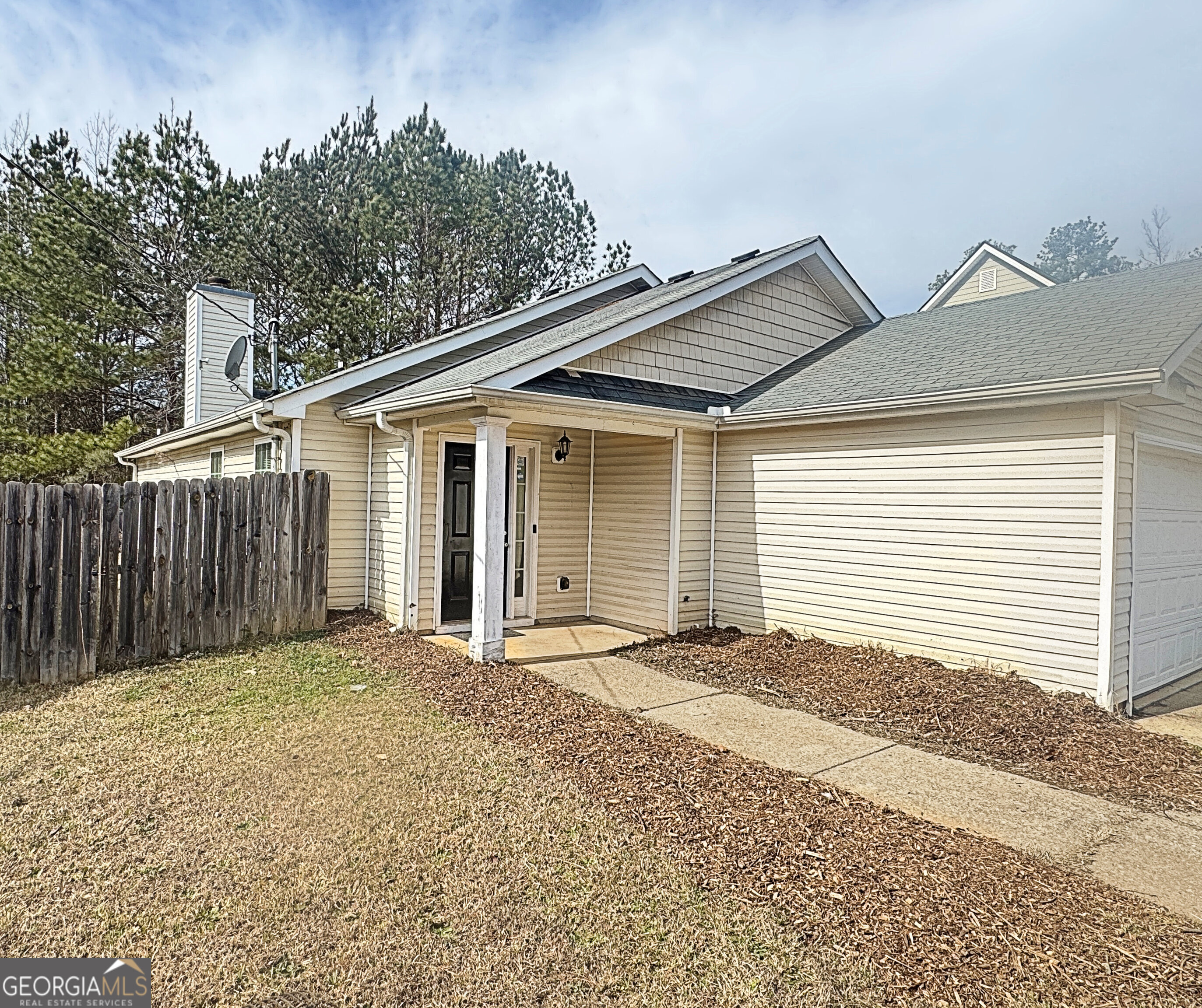 203 Jerry Road Hogansville, GA 30230 - Photo 5 of 51 a view of a house with a backyard and a garage