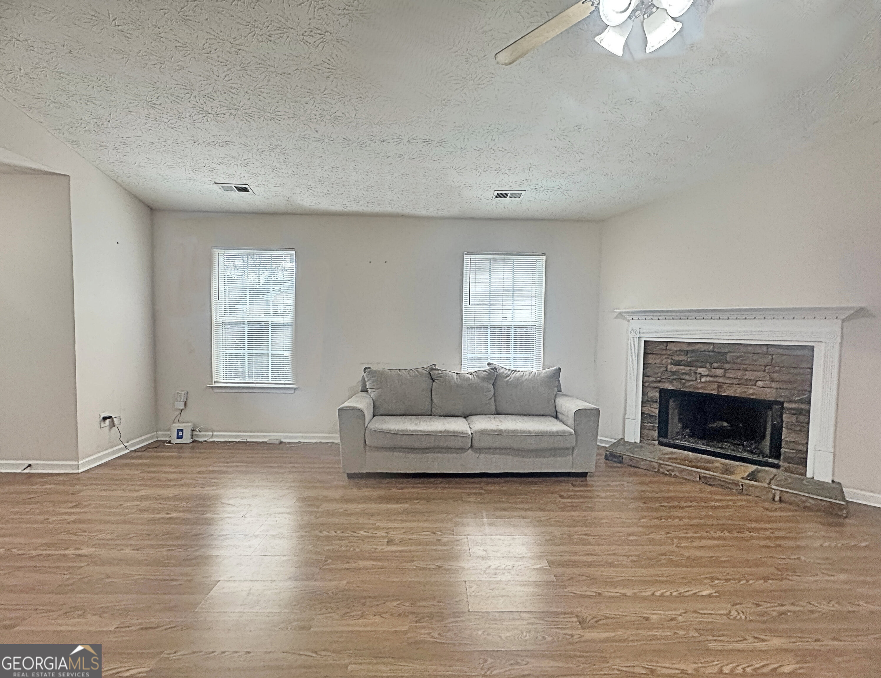 203 Jerry Road Hogansville, GA 30230 - Photo 8 of 49 a living room with furniture and a fireplace