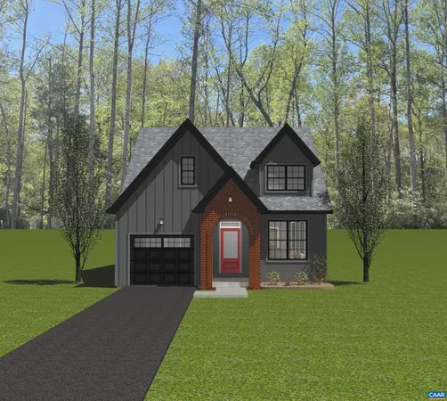 a front view of a house with a garden and yard