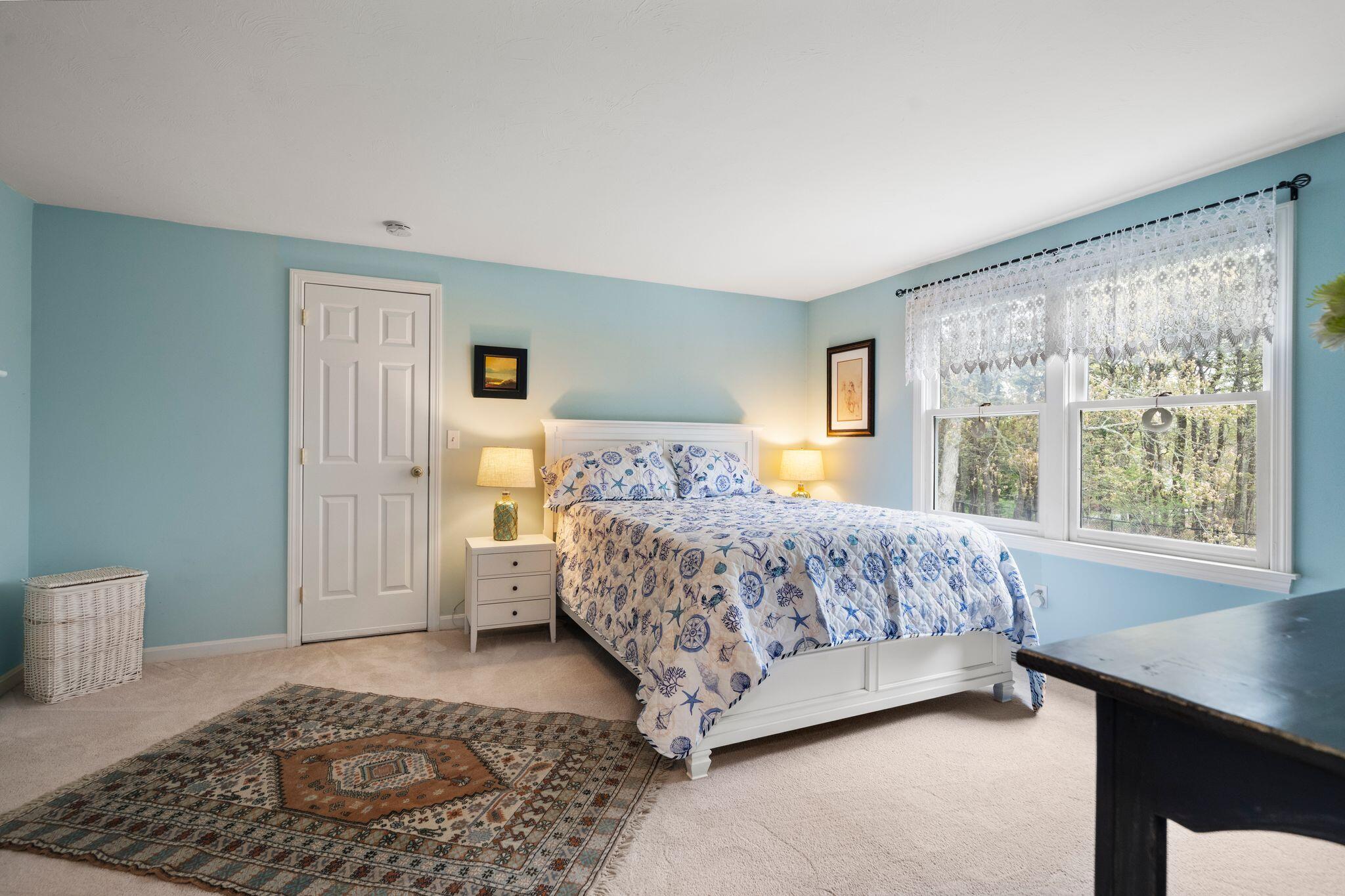 40 Sam Ryder Road Chatham, MA 02633 - Photo 30 of 42 a bedroom with a large bed rug and window