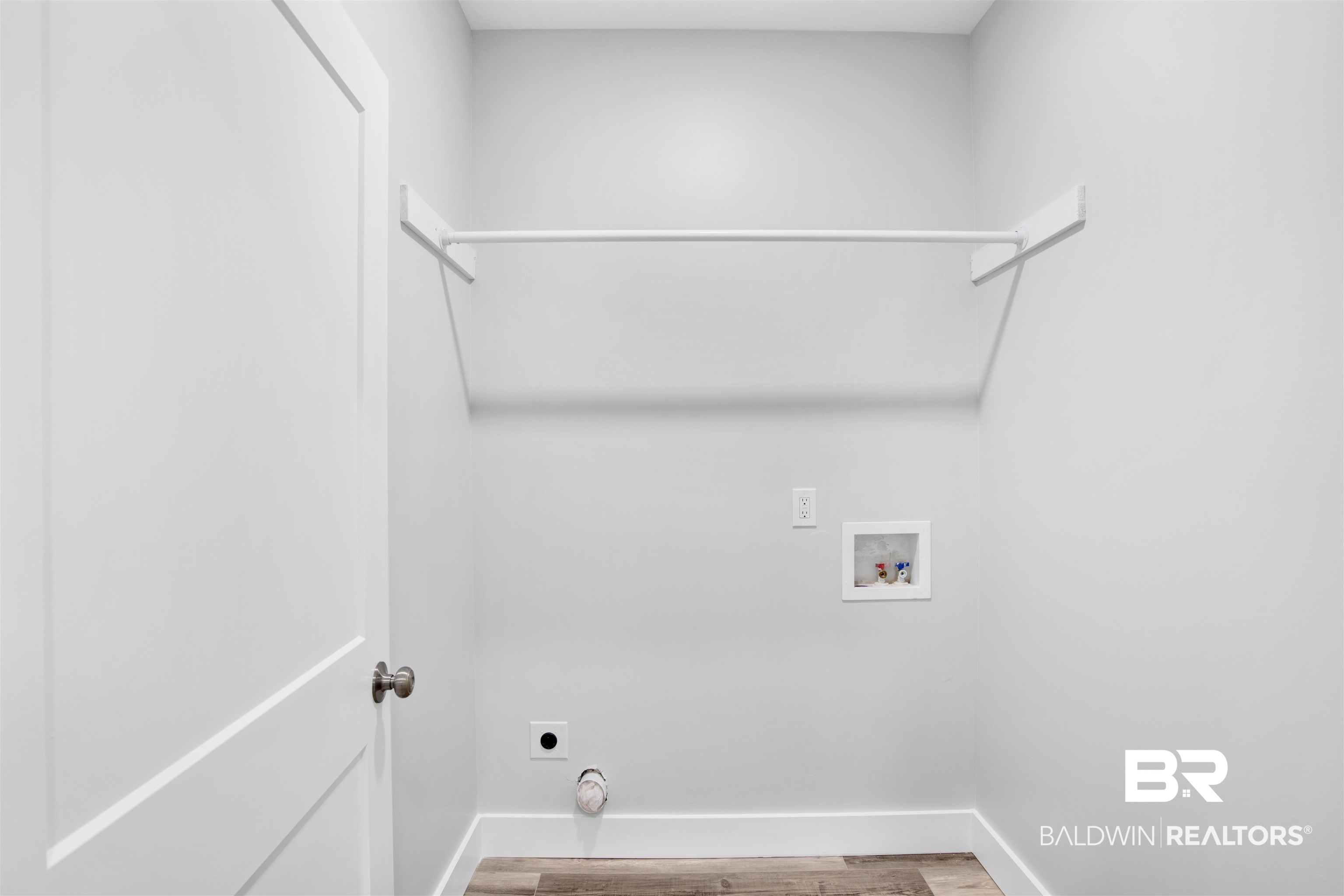 30604 Orange Street Elberta, AL 36530 - Photo 12 of 27 Clothes washing area featuring hardwood / wood-style floors, hookup for a washing machine, and electric dryer hookup