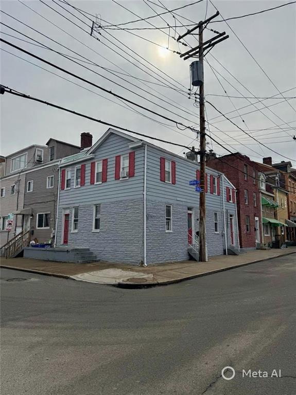 a view of a building with a street