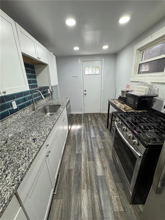 67 South 17th Street Pittsburgh, PA 15203 - Photo 4 of 9 a kitchen with sink stove and cabinets