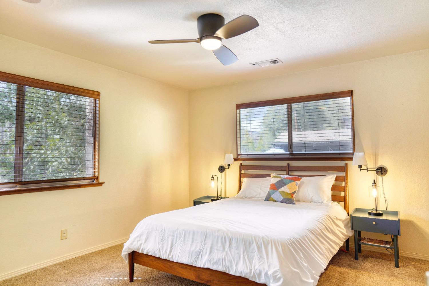 42917 Scenic Drive Oakhurst, CA 93644 - Photo 11 of 50 a bedroom with a bed and a window