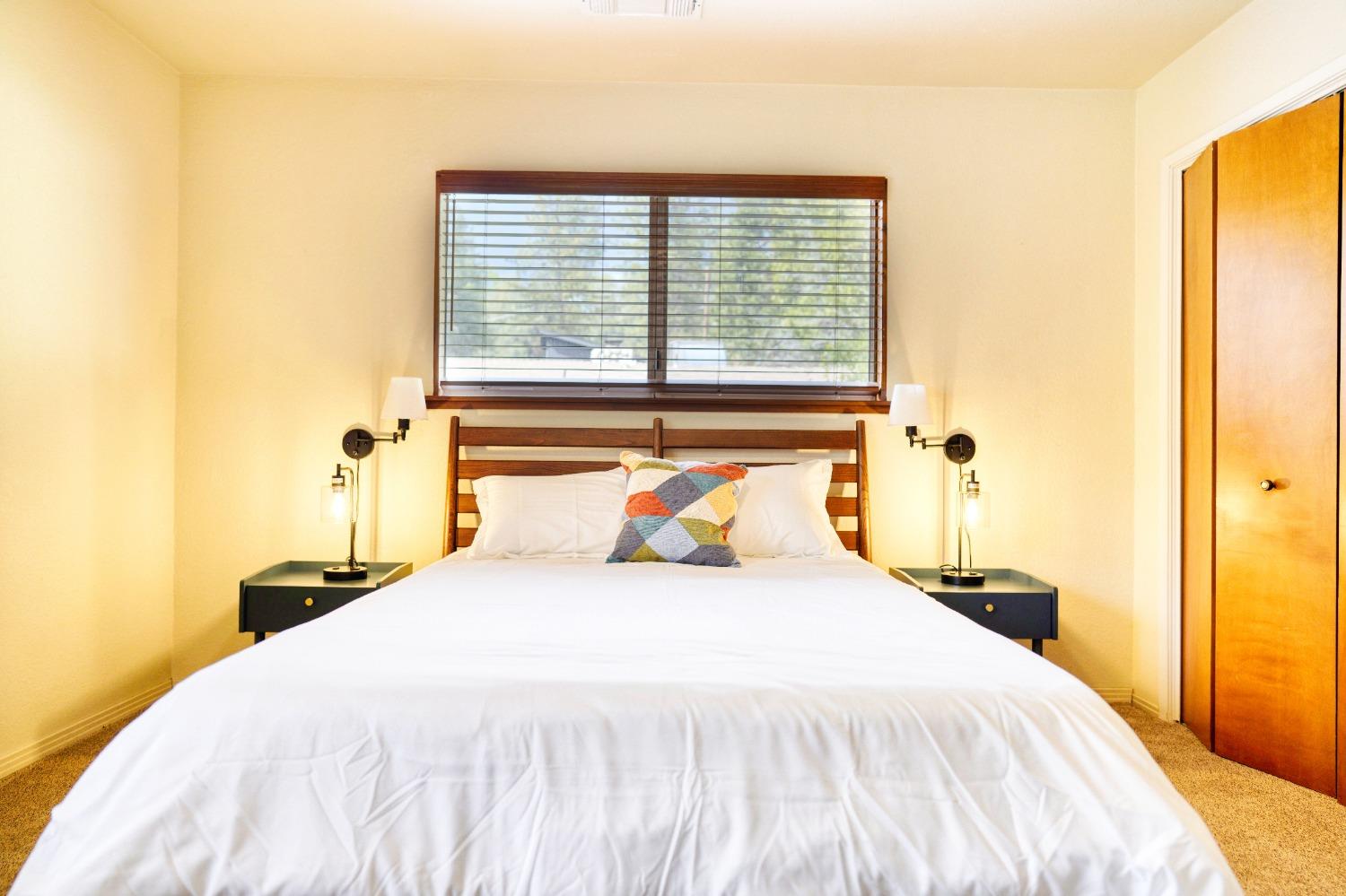 42917 Scenic Drive Oakhurst, CA 93644 - Photo 12 of 50 a bedroom with a bed and a window