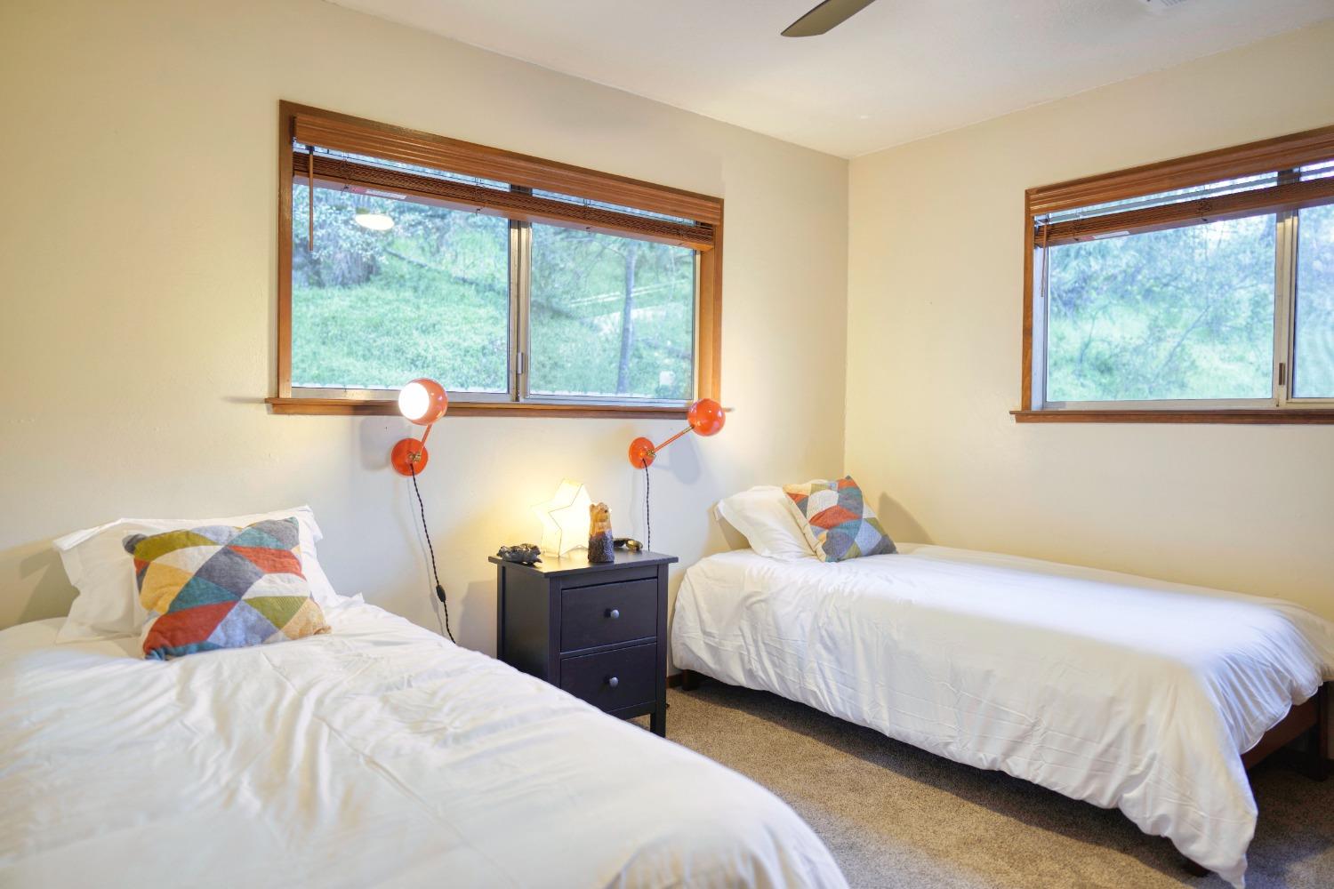 42917 Scenic Drive Oakhurst, CA 93644 - Photo 23 of 50 a bedroom with a bed and a window