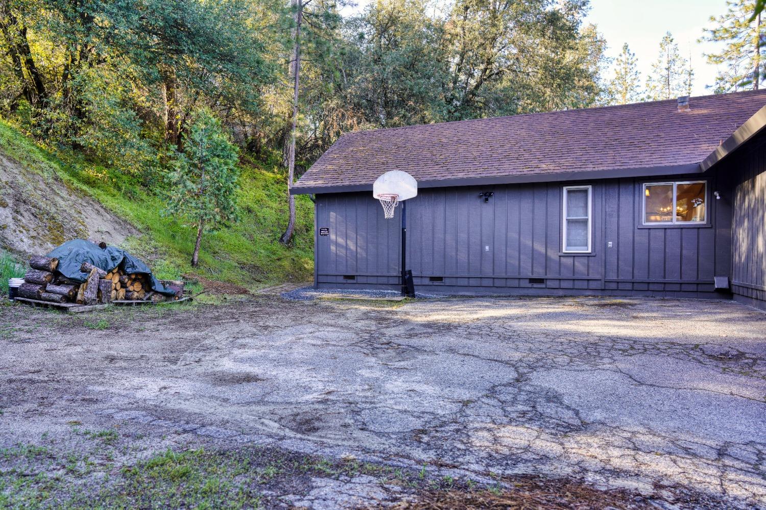 42917 Scenic Drive Oakhurst, CA 93644 - Photo 29 of 50 a view of a house with a yard and garage