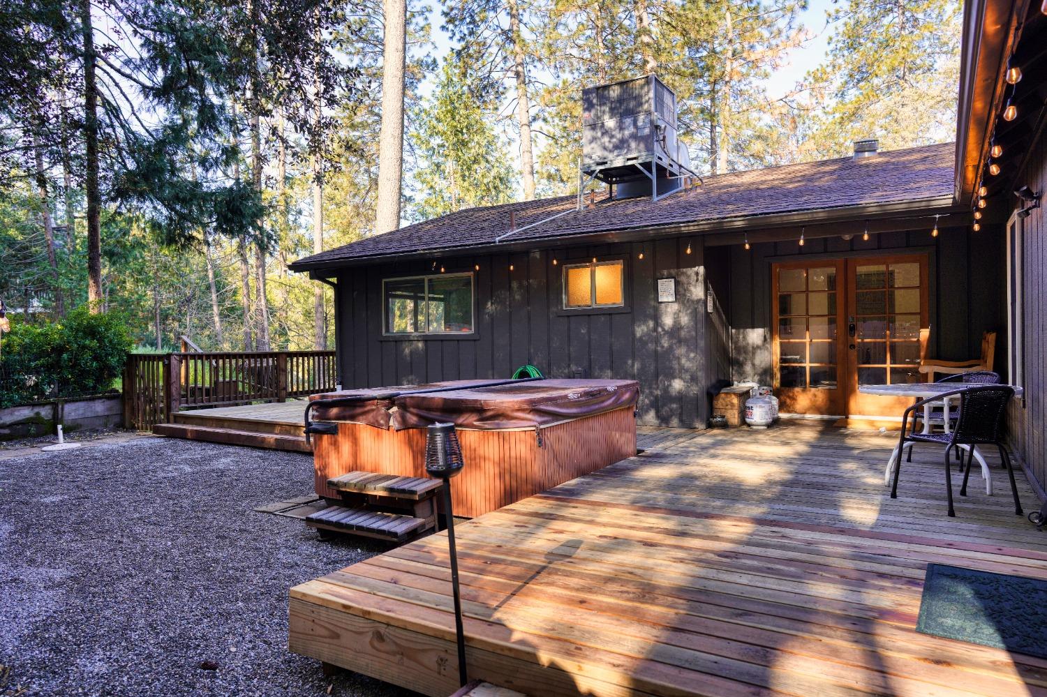 42917 Scenic Drive Oakhurst, CA 93644 - Photo 33 of 50 a view of a chairs and table in the backyard