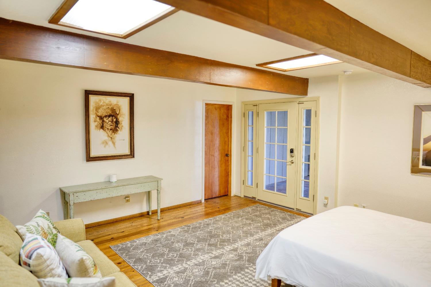 42917 Scenic Drive Oakhurst, CA 93644 - Photo 40 of 50 a bedroom with a bed and a table