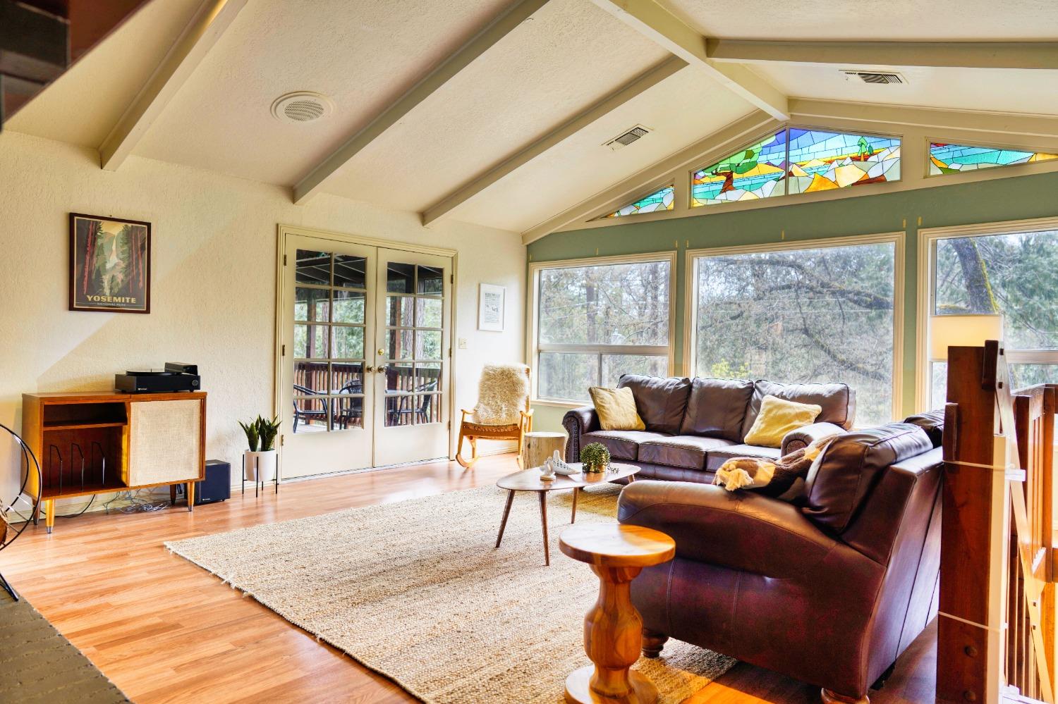 42917 Scenic Drive Oakhurst, CA 93644 - Photo 4 of 50 a living room with furniture and a floor to ceiling window