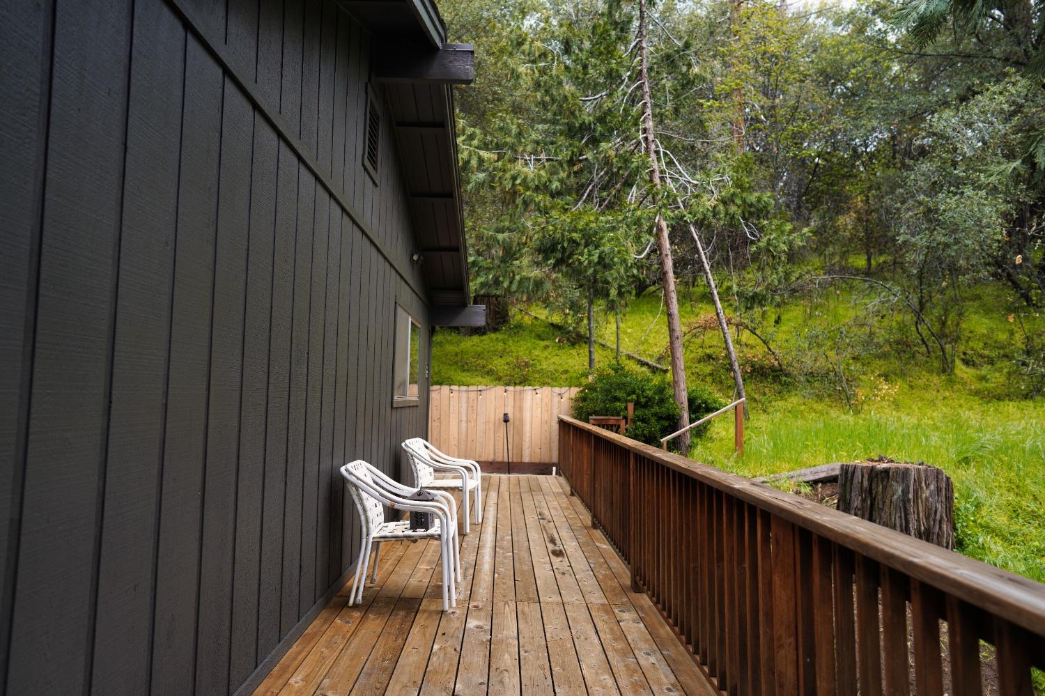 42917 Scenic Drive Oakhurst, CA 93644 - Photo 10 of 50 a view of balcony with wooden floor and outdoor seating