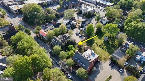 an aerial view of residential house with outdoor space and swimming pool
