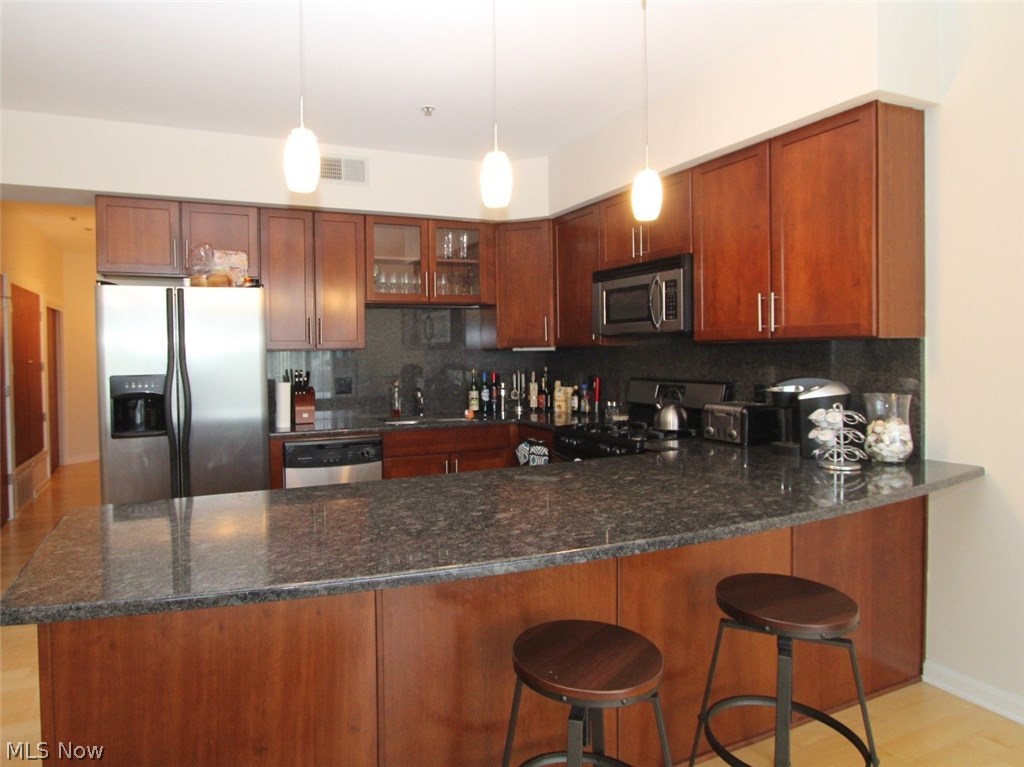 1237-802 Washington Avenue, Unit 802 Cleveland, OH 44113 - Photo 7 of 16 Kitchen with granite & stainless