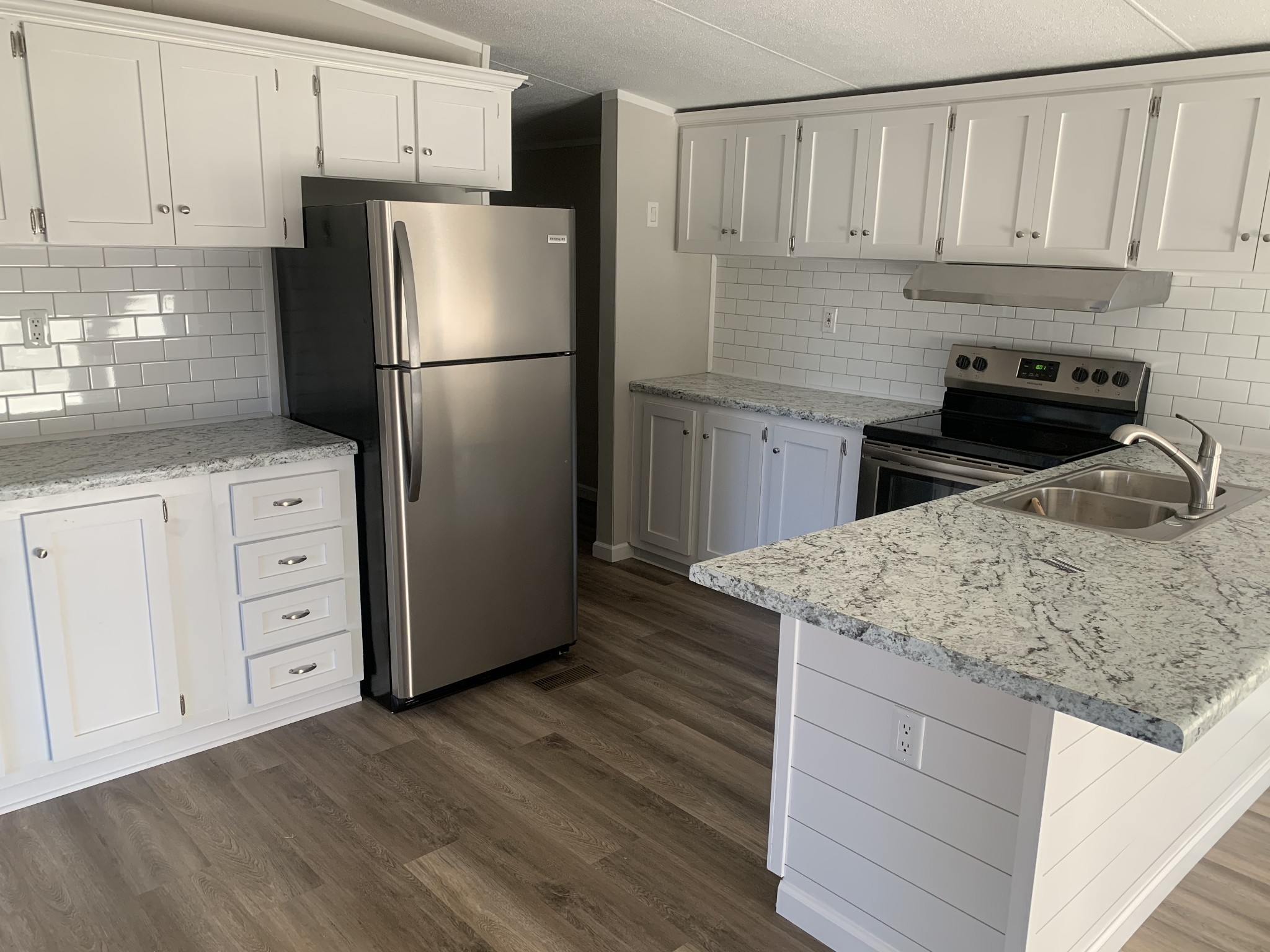 784 Speck Road Lebanon, TN 37087 - Photo 1 of 35 a kitchen with granite countertop a refrigerator sink and cabinets