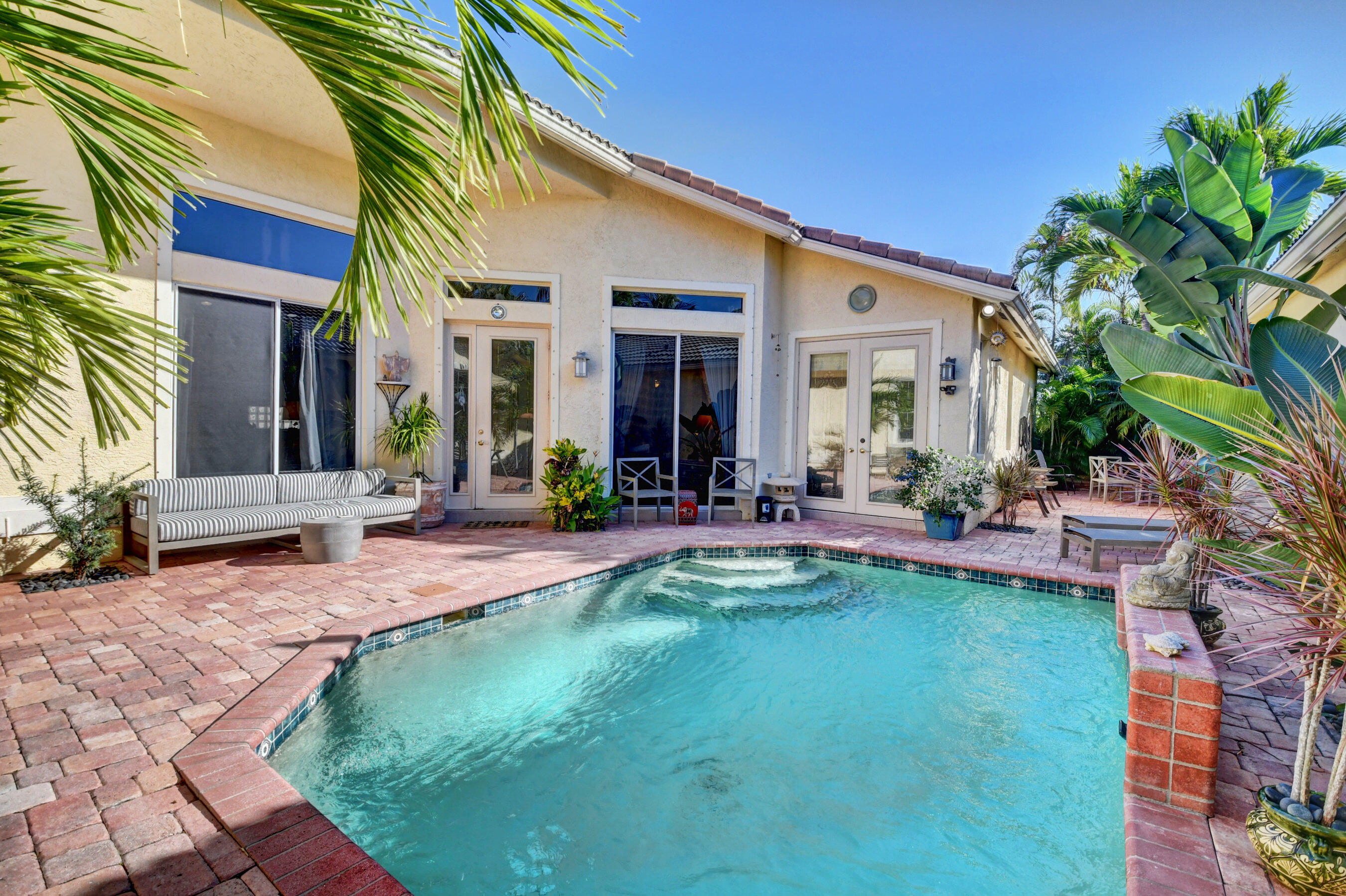 7080 Northwest Turtle Walk Boca Raton, FL 33487 - Photo 1 of 42 Beautiful Private Courtyard Pool