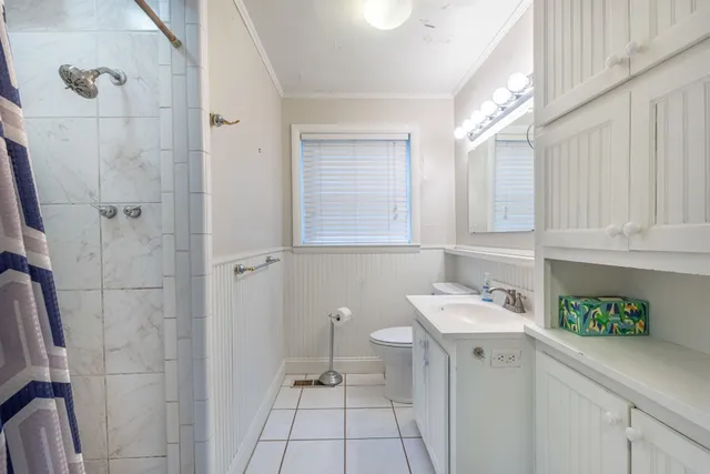 a room that has a sink and a window in it